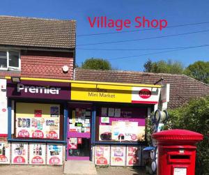 a v mileage shop with a red mailbox in front of it at Bean Farm House Apartment in Stonewood