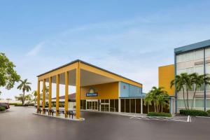 a rendering of a building with a parking lot at Days Inn by Wyndham Miami International Airport in Miami