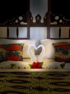 Cama o camas de una habitación en Simba Beach Zanzibar