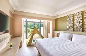 Cama ou camas em um quarto em Shangri-La Rasa Sentosa, Singapore