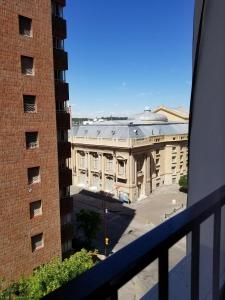 a view of a building from a balcony at M&A Apartament Centro in Bahía Blanca