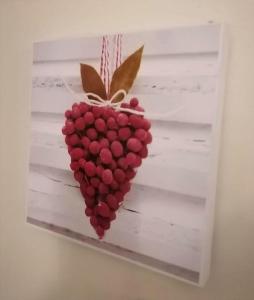 a heart shaped fruit hanging on a wall at DaFolSuite Luxury Stay - Free WiFi with Netflix Entertainment in Tilbury