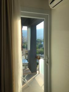 a room with a door open to a balcony with a view at Kyrenia central 2+1 in Kyrenia