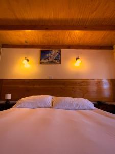 Postel nebo postele na pokoji v ubytování Ittai Hotel