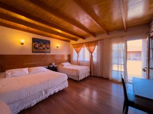 Postel nebo postele na pokoji v ubytování Ittai Hotel