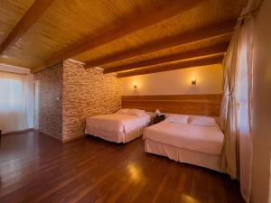 Postel nebo postele na pokoji v ubytování Ittai Hotel