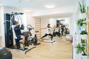 a group of people exercising in a gym at Hotel Euler Basel in Basel