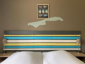 Ένα ή περισσότερα κρεβάτια σε δωμάτιο στο Hotel DoniaState