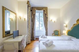 Postel nebo postele na pokoji v ubytování DCBoutiqueHotel