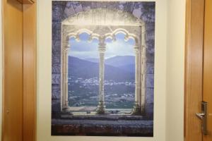 a picture of a window with a view at Altitude Alojamento e Restauração in Belmonte