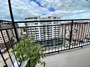 a balcony with a view of a large building at Belvederska apartment 2 in Ivano-Frankivsk