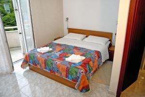 Postel nebo postele na pokoji v ubytování Hotel Carmen