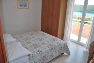 Postel nebo postele na pokoji v ubytování Hotel Carmen