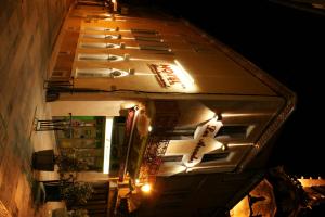 an external view of a building at night at Les Arcades in Limoux