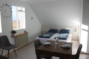 Postel nebo postele na pokoji v ubytování Guesthouse Hateigi 3