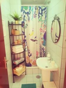 a bathroom with a shower curtain and a sink at Oportobestview - TopLoft in Porto