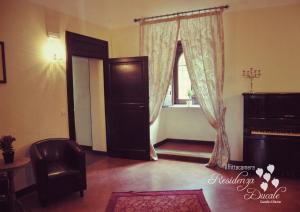 a living room with a door and a window at Residenza Ducale in Bovino