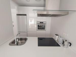 Kuchyňa alebo kuchynka v ubytovaní APARTAMENTO TERRAZAS DEL MAR, PISCINA PRIVADA