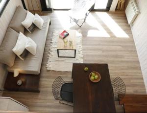 a living room with a couch and a table at Solo Lofts in El Chalten