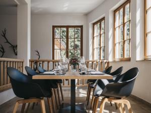 a dining room with a table and chairs at VAYA Zell am See in Zell am See