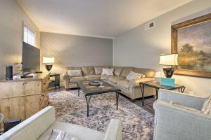a living room with a couch and a table at Charming Southern Pines Abode - Walk to Dtwn! in Southern Pines