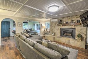 a living room with couches and a fireplace at Spacious Home with Yard, 20 Miles to Olympic NP in Sequim