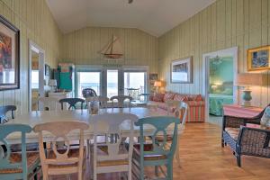 a dining room with a table and chairs at Peaceful Cottage By The Sea Oceanfront Home! in Surf City