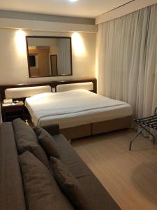 Postel nebo postele na pokoji v ubytování CHA Prime Curitiba