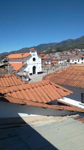 a view of a church with red roofs at Hostal El Gran Gocta in Chachapoyas