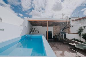 a swimming pool in the backyard of a house at Casinha do Roxo in Ervidel
