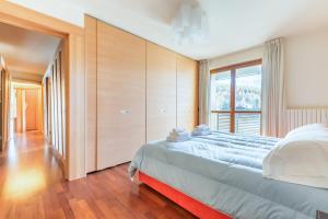 Posteľ alebo postele v izbe v ubytovaní Terrazza su Sestriere Lux