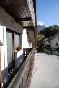 
a view from a balcony of a building with a view of the street at Rooms Cvitar - Center in Kranjska Gora
