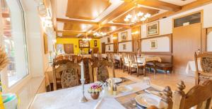 a dining room with a table and chairs at Nature Hotel Lukanc in Bled