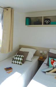 Postel nebo postele na pokoji v ubytování Évasion Lodge