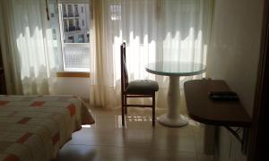 Łóżko lub łóżka w pokoju w obiekcie Hostal Casa Maria