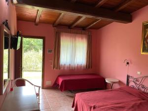 Postel nebo postele na pokoji v ubytování Agriturismo Montefosco