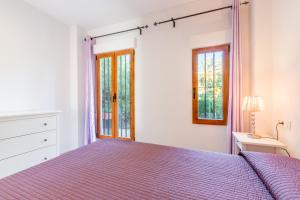Posteľ alebo postele v izbe v ubytovaní Altea Villa Buraux , Apartamento con vistas al mar & parking en el corazón del casco viejo de Altea
