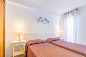Posteľ alebo postele v izbe v ubytovaní Altea Villa Buraux , Apartamento con vistas al mar & parking en el corazón del casco viejo de Altea