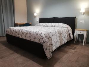 Postel nebo postele na pokoji v ubytování La Casa Tra Gli Ulivi