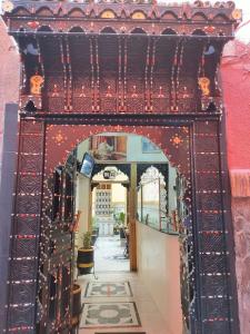 an entrance to a building with an archway at Hotel Zagora in Marrakech