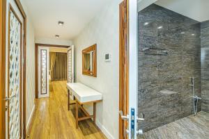 a bathroom with a sink and a shower at Baku Fantastic Port Baku Residance in Baku +34 photos