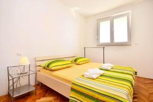 Postel nebo postele na pokoji v ubytování Apartment Tam - with parking