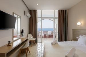 Postel nebo postele na pokoji v ubytování Europa Resort Hotel