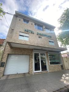 a building with a hotel overseas sign on it at Hotel Di Sorrento in Mar del Plata +35 photos