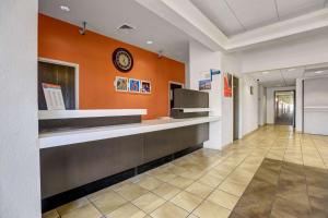 a lobby of a hospital with a clock on the wall at Motel 6-Benson, AZ in Benson