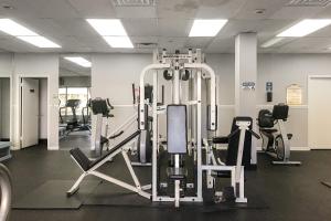 a gym with several tread machines in a room at Braemar Towers in Ocean City +8 photos