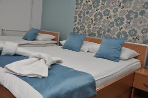 Voodi või voodid majutusasutuse Garni Hotel Laguna Lux toas