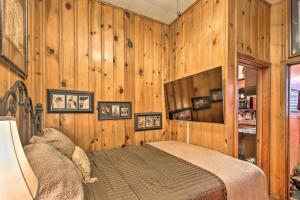 a bedroom with wooden walls and a bed in it at La Villa By The Riverwalk in San Antonio