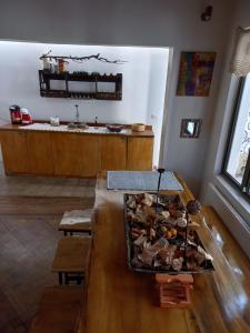 a room with a table with a bunch of stuffed animals at Hotel Nativo in Santiago