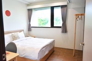 Postel nebo postele na pokoji v ubytování Golden W Hotel